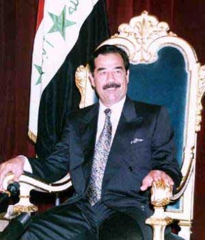 Saddam Hussein has jet black hair, thick eyebrows and a mustache